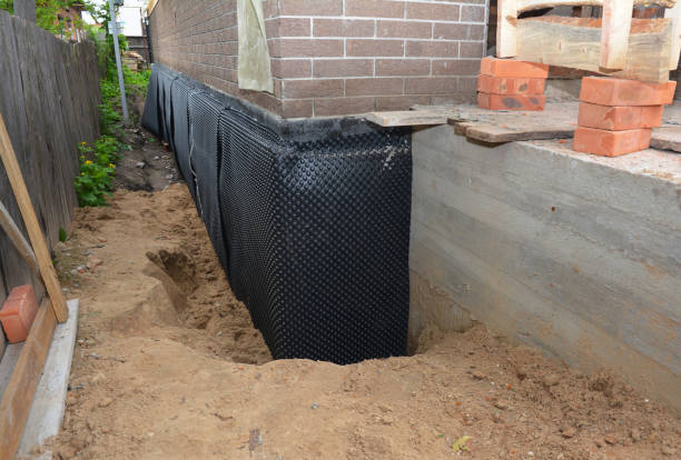 SJ Waterproofing Pros technician performing targeted Emergency Waterproofing assessment in Topeka, KS